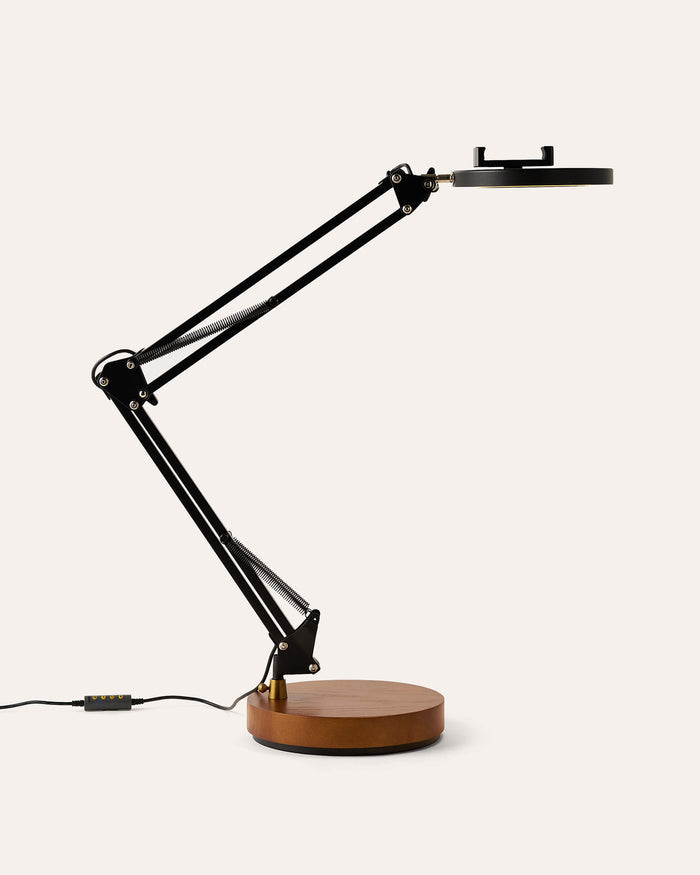 Black adjustable Canvas LED desk lamp with wooden base on a white background