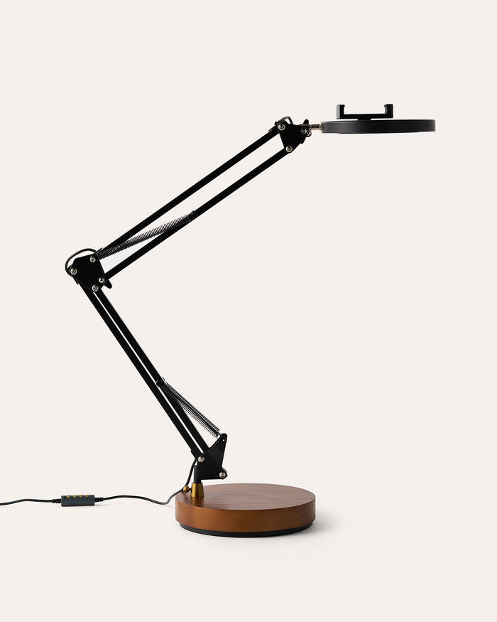 Black adjustable Canvas LED desk lamp with wooden base on a white background