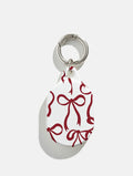 Burgundy Bows AirTag Case in Gloss AirTags Cases Skinnydip London