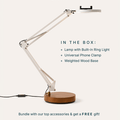 Canvas LED desk lamp with a white articulated arm, a round wooden base, and a built-in ring light at the top for taking video with phones