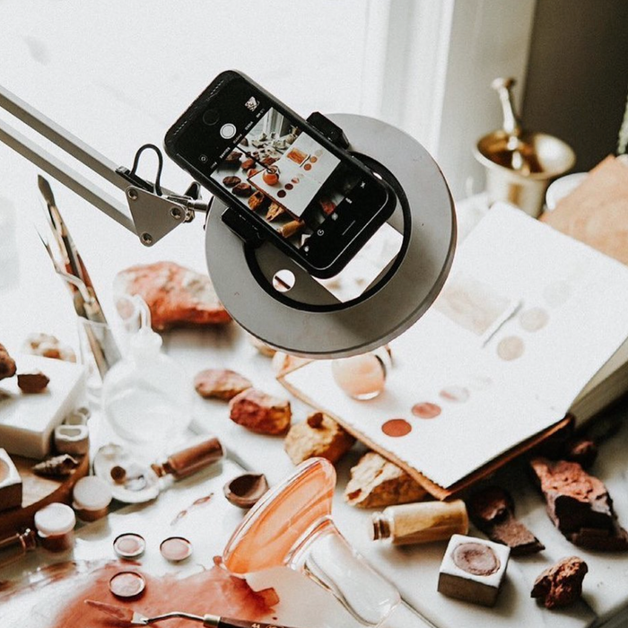 overhead view of iphone mounted to canvas LED desk lamp